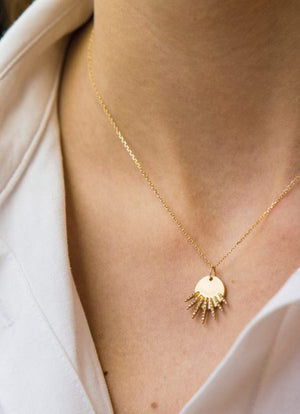Céline Daoust - diamonds sunbeams medal necklace