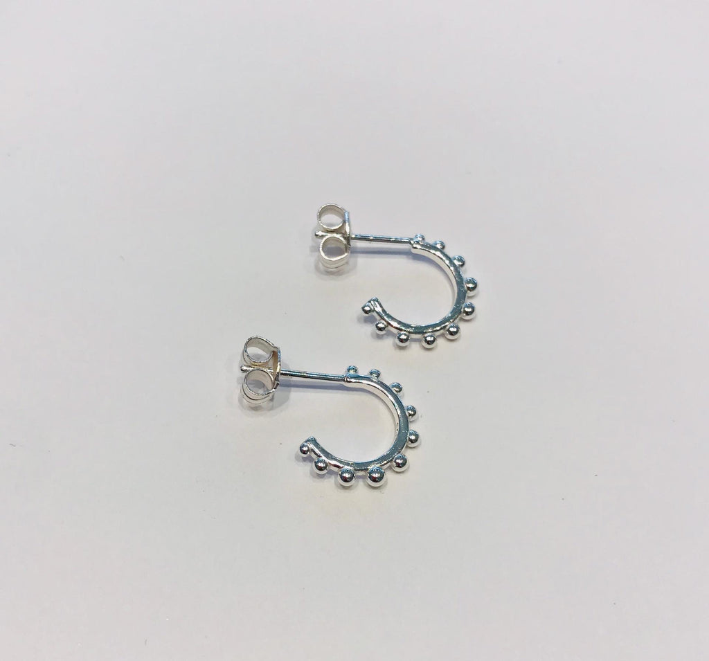 Small silver creole earrings by SAM&CEL.