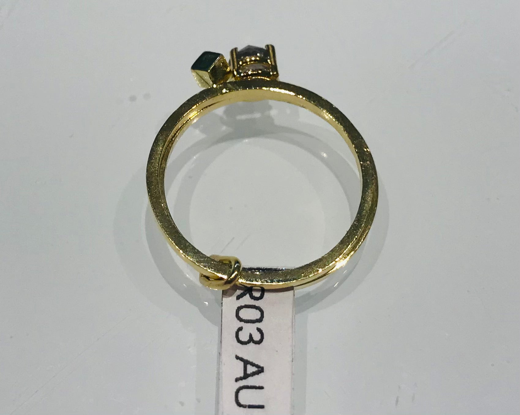Lore Van Keer UNR R03 golden ring with diamond and cube