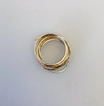  this 7 mix ring by Wouters & Hendrix. The ring include 7 separate rings of which 5 are silver and 2 gold plated. 2 of the silver rings and 1 gold plated ring have an oval shape. 