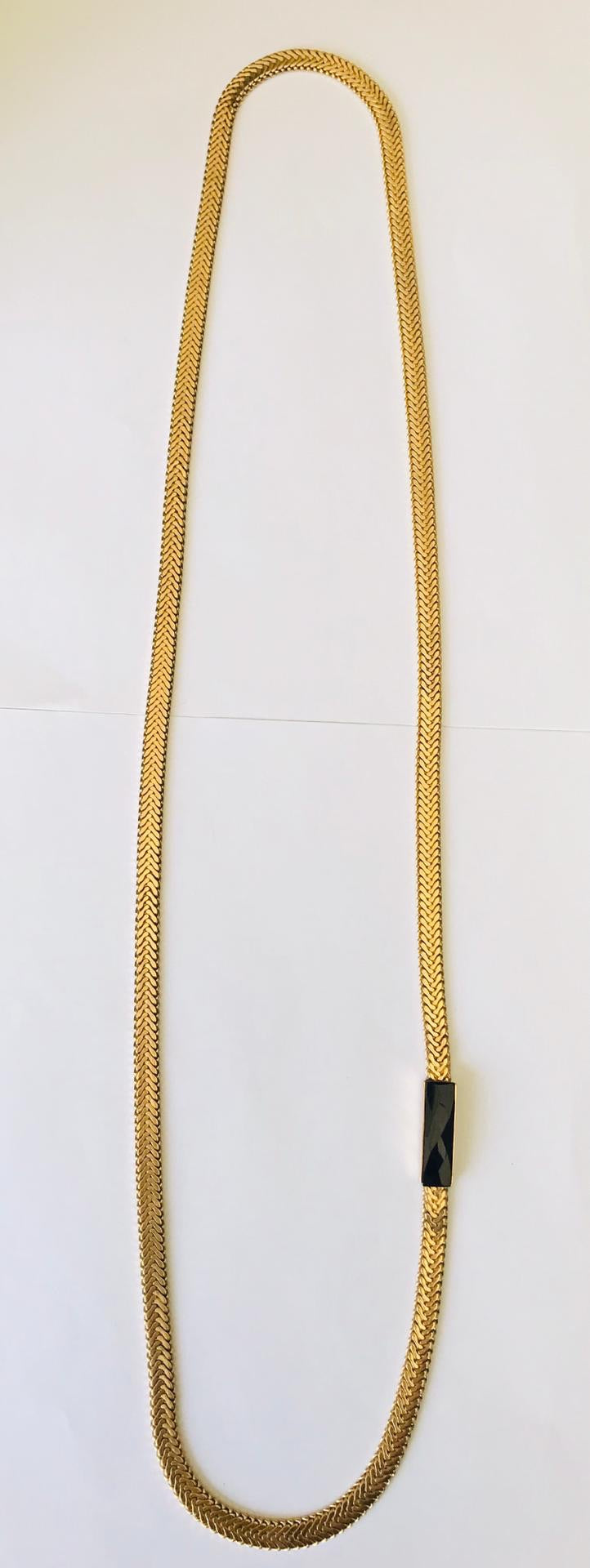 Wouters & Hendrix - long gold plated necklace with faceted onyx stone